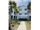 Apartment building with blue shutters and balconies offers a charming coastal living experience at 1300 Park West Blvd # 406, Mount Pleasant, SC 29466
