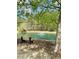 Scenic pond with a fountain, providing a peaceful retreat with a bench for relaxation at 1300 Park West Blvd # 406, Mount Pleasant, SC 29466