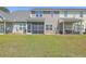 Spacious townhouse backyard with a screened in porch and well-maintained lawn, perfect for outdoor enjoyment at 131 Buchanan Cir, Goose Creek, SC 29445