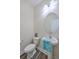 Bathroom featuring an oval mirror, a pedestal sink with a blue towel, and a nearby toilet at 131 Buchanan Cir, Goose Creek, SC 29445