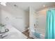 Bathroom with double sinks, a shower and bathtub combo with a blue curtain, and neutral wall color at 131 Buchanan Cir, Goose Creek, SC 29445