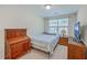 Cozy bedroom with natural light, a wooden desk, and neutral tones for a comfortable living space at 131 Buchanan Cir, Goose Creek, SC 29445