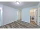 Open room featuring access to laundry room, neutral walls, hard surface flooring, and an overhead light at 131 Buchanan Cir, Goose Creek, SC 29445
