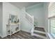 Inviting foyer featuring a staircase, decorative console table, and stylish flooring, for a modern entrance at 131 Buchanan Cir, Goose Creek, SC 29445