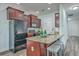 Well-equipped kitchen with granite countertops, and dark wood cabinetry at 131 Buchanan Cir, Goose Creek, SC 29445