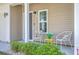 Inviting porch with chairs and accent table, perfect for relaxing and enjoying the outdoors at 131 Buchanan Cir, Goose Creek, SC 29445