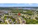 Aerial view of a lovely neighborhood nestled amongst lush trees with waterway access and convenient amenities at 1325 Whisker Pole Ln, Mount Pleasant, SC 29466