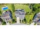Aerial view of the property showcasing the home, backyard, pool, and surrounding landscape within the neighborhood at 1325 Whisker Pole Ln, Mount Pleasant, SC 29466