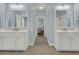 Hallway view of a bathroom with a large vanity and elegant fixtures, providing ample space at 1325 Whisker Pole Ln, Mount Pleasant, SC 29466