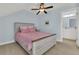 Charming bedroom features a cozy bed and a peek into an ensuite bathroom, creating a private retreat at 1325 Whisker Pole Ln, Mount Pleasant, SC 29466