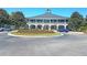 A beautiful clubhouse in the Dunes West community featuring a circular drive and manicured landscaping at 1325 Whisker Pole Ln, Mount Pleasant, SC 29466