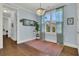 Light-filled dining room with a chandelier, large window, and an elegant area rug creates a welcoming space at 1325 Whisker Pole Ln, Mount Pleasant, SC 29466
