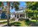 Charming two-story home with a welcoming front porch, manicured landscaping, and an inviting curb appeal at 1325 Whisker Pole Ln, Mount Pleasant, SC 29466