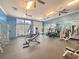 Bright, spacious gym with workout equipment, mirrors and ceiling fans at 1325 Whisker Pole Ln, Mount Pleasant, SC 29466
