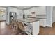 Stylish kitchen with a granite island, stainless steel appliances, white cabinets, and hardwood floors at 1325 Whisker Pole Ln, Mount Pleasant, SC 29466