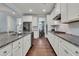 Spacious kitchen features granite countertops, stainless steel appliances, and ample cabinet space at 1325 Whisker Pole Ln, Mount Pleasant, SC 29466