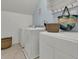 Well-organized laundry room with modern appliances, storage, and a convenient drying rack at 1325 Whisker Pole Ln, Mount Pleasant, SC 29466