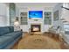 Comfortable living room with fireplace, built-in shelving, and cozy seating at 1325 Whisker Pole Ln, Mount Pleasant, SC 29466