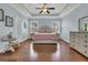 Spacious bedroom boasts tray ceilings, ceiling fan, and a light blue paint scheme, creating a relaxing retreat at 1325 Whisker Pole Ln, Mount Pleasant, SC 29466