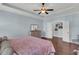 Large bedroom with wood floors, a walk in closet, and soft lighting, perfect for comfort at 1325 Whisker Pole Ln, Mount Pleasant, SC 29466