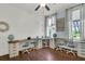 Bright office space with multiple desks, natural light, and hardwood floors at 1325 Whisker Pole Ln, Mount Pleasant, SC 29466