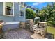 Outdoor kitchen with stone counter, built-in grill, and brick-paved patio area at 1325 Whisker Pole Ln, Mount Pleasant, SC 29466