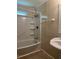 Practical bathroom with tile surround tub/shower and vintage-inspired sink at 136 Gailmoor Dr, Ladson, SC 29456