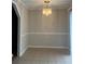 Clean dining area featuring wainscoting and a modern chandelier at 136 Gailmoor Dr, Ladson, SC 29456