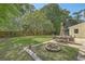 Outdoor patio and fire pit area in backyard; great for entertaining and relaxation at 141 Bridgecreek Dr, Goose Creek, SC 29445