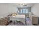 This cozy bedroom features wood-look floors, a ceiling fan, and three dressers for ample storage at 141 Bridgecreek Dr, Goose Creek, SC 29445