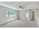 Neutral bedroom with gray walls, a ceiling fan, and lots of natural light from the bright window at 141 Bridgecreek Dr, Goose Creek, SC 29445