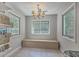 Bright dining area featuring tile floors, a modern chandelier and multiple windows providing ample natural light at 141 Bridgecreek Dr, Goose Creek, SC 29445