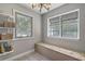 Bright dining area featuring tile floors and multiple windows providing ample natural light at 141 Bridgecreek Dr, Goose Creek, SC 29445