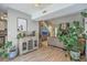 Inviting entryway leading to a living space with a stone fireplace, complemented by stylish decor and ample natural light at 141 Bridgecreek Dr, Goose Creek, SC 29445