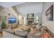 Open living room with vaulted ceilings, a stone fireplace, and a large sectional sofa, perfect for entertaining at 141 Bridgecreek Dr, Goose Creek, SC 29445