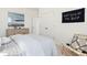 Bright bedroom showcasing white walls, a cozy chair, and large closet with a decorative accent at 1427 Clay Field Trl, Summerville, SC 29485