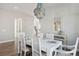 Dining room with white furniture and a blue chandelier at 1427 Clay Field Trl, Summerville, SC 29485