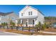 Attractive two-story house with a covered porch and neatly landscaped front yard at 1427 Clay Field Trl, Summerville, SC 29485