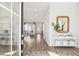 Inviting foyer leads into a bright, open-concept living space with beautiful hardwood floors at 1427 Clay Field Trl, Summerville, SC 29485