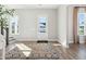 Sunlit foyer with a decorative rug, staircase, and white door that welcomes you home at 1427 Clay Field Trl, Summerville, SC 29485