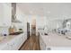 Bright, open kitchen featuring white cabinets, stainless steel appliances, and a large island at 1427 Clay Field Trl, Summerville, SC 29485