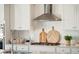 Well-equipped kitchen boasts stainless steel appliances and stylish white backsplash at 1427 Clay Field Trl, Summerville, SC 29485