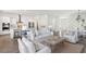 Open concept living room shows kitchen and dining area; bright and spacious at 1427 Clay Field Trl, Summerville, SC 29485