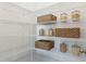 Pantry with wire shelving, displaying jars and baskets at 1427 Clay Field Trl, Summerville, SC 29485