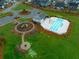 A community pool with the playground and parking spots in an aerial view at 145 Basket Grass Ln, Summerville, SC 29486