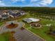 Aerial view of a neighborhood with a lake and community pool at 145 Basket Grass Ln, Summerville, SC 29486