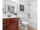 The full bathroom has a vanity, framed mirror, toilet, and tub with shower head at 145 Basket Grass Ln, Summerville, SC 29486
