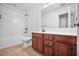 Bathroom featuring a wood vanity, tile floor, tub, and shower combo at 145 Basket Grass Ln, Summerville, SC 29486