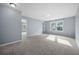 Spacious bedroom with soft gray walls, carpet, natural light from the windows, and neutral tones at 145 Basket Grass Ln, Summerville, SC 29486