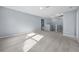 Bright and spacious carpeted bonus room perfect for a play area or media room with neutral paint and recessed lighting at 145 Basket Grass Ln, Summerville, SC 29486